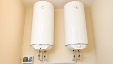 Two electric water heaters on the wall
