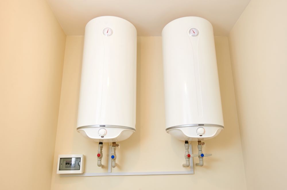 Two electric water heaters on the wall